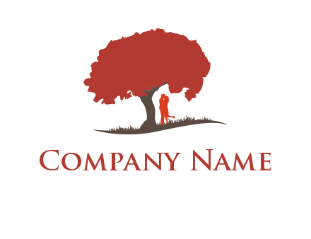 couple kissing under a tree logo